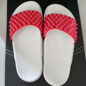 Pink and white pool slides . Comes with dust bag